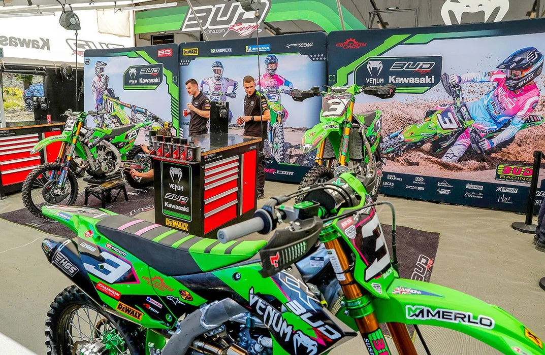 Photo of BUD Racing Kawasaki mechanics in their pit during a race.